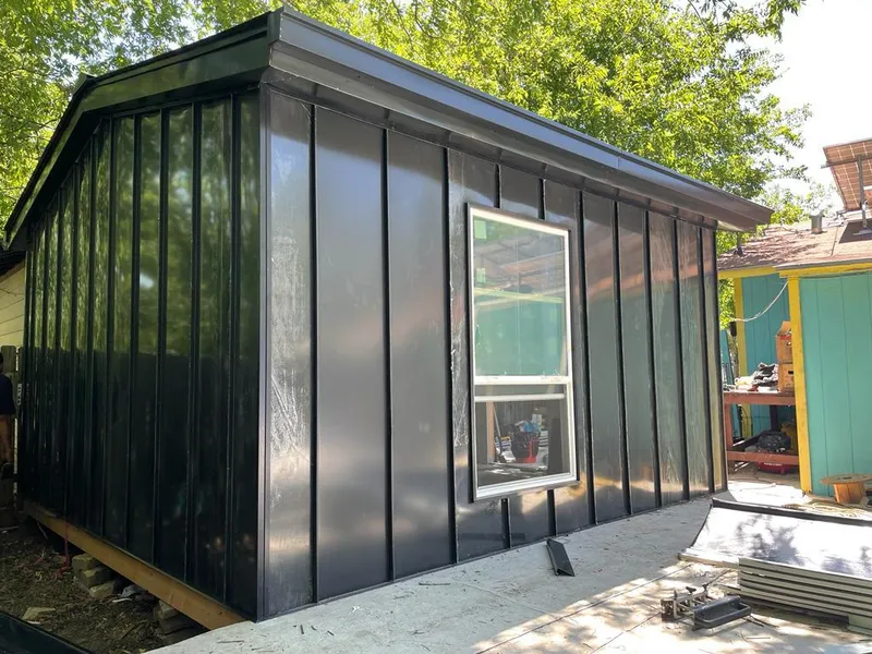 Black standing seam metal wall panels for Roof Inspection in Lawrence