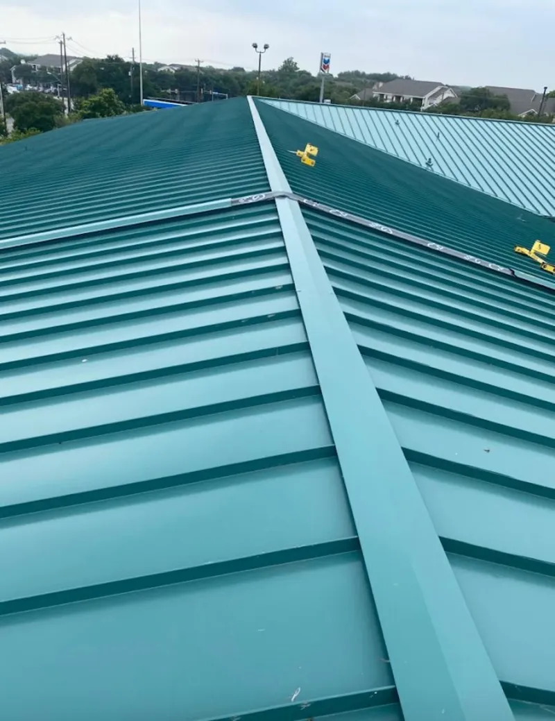 Green commercial metal roof ridge and valley for Metal Roof Repair in Lawrence