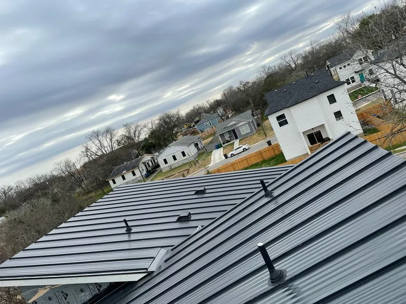 Standing seam metal roof panels with vents for Skylight Repair in Lawrence